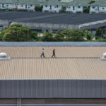 Engineer,Inspects,The,Factory,Roof.