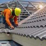 Roof,Repair,,Worker,Replacing,Gray,Tiles,Or,Shingles,On,House