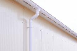 White,Plastic,Rain,Guttering,System.,Guttering,Drainage,Pipe,Exterior.,Background