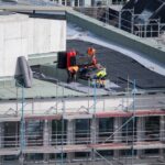 Birdseye,View,Of,Roofer,Waterproofing,The,Flat,Roof,Of,A